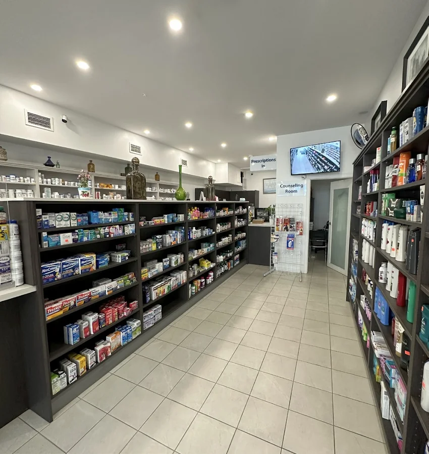 Product aisle and counseling room inside St. Clair Drug Mart Pharmacy